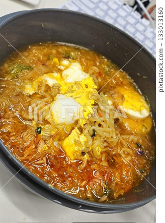 Shin Ramyun,close up of Ramyeon or Ramyun is a Korean-style soup noodle dish with a spicy flavor. Ramyeon or Korean instant noodles with egg - Korean food style Shin Ramyun,close up of Ramyeon or Ramyun is a Korean-style soup noodle dish with a spicy flavor. Ramyeon or Korean instant noodles with egg - Korean food style 133013160