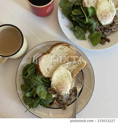 Golden, fluffy French toast with a crisp edge and soft center, topped with syrup, fruits, or powdered sugar—offering a perfect balance of sweetness, warmth, and comfort in every delightful bite. 133013227