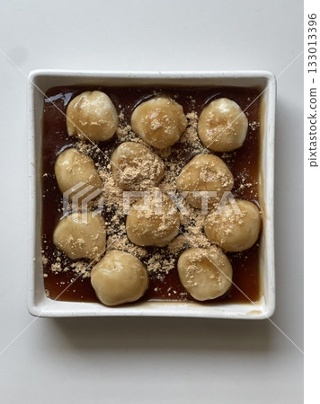 Mitarashi dango, skewered rice dumplings glazed with a sweet soy sauce syrup, offering a delightful balance of sweetness and umami. A classic Japanese snack perfect for any occasion. Mitarashi dango, skewered rice dumplings glazed with a sweet soy sauce syrup, offering a delightful balance of sweetness and umami. A classic Japanese snack perfect for any occasion. 133013396