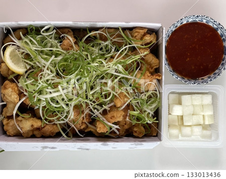 Crispy fried chicken with golden, crunchy skin and juicy, tender meat. A delicious and savory dish, perfect for any meal, served with dipping sauces or side dishes for extra flavor! 133013436