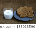 Glass of milk and whole grain toast 133013590