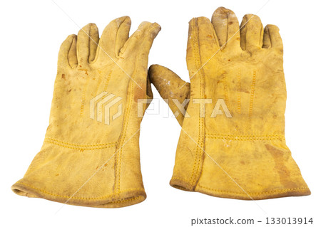 Yellow work gloves Dirty Old isolated on white background Yellow work gloves Dirty Old isolated on white background 133013914