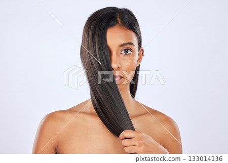 Woman, hair and beauty and haircare with cosmetics, keratin treatment and portrait on studio background. Serious, Indian female with straight hairstyle and skin glow, Brazilian and cosmetic care Woman, hair and beauty and haircare with cosmetics, keratin treatment and portrait on studio background. Serious, Indian female with straight hairstyle and skin glow, Brazilian and cosmetic care 133014136