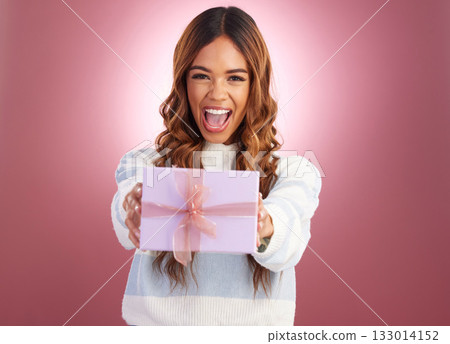Woman, present and box in studio portrait with giving surprise, happy or celebration by gradient background. Student girl, young or happiness with gift package, excited face or celebrate for giveaway 133014152