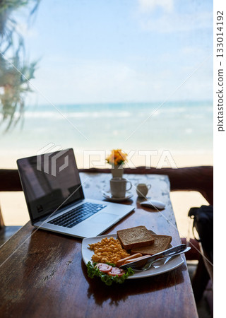 Laptop, beach or empty table at restaurant at remote online workspace in the morning connection. Background, internet or luxury seaside cafe for digital blog online with brunch meal, coffee or food Laptop, beach or empty table at restaurant at remote online workspace in the morning connection. Background, internet or luxury seaside cafe for digital blog online with brunch meal, coffee or food 133014192