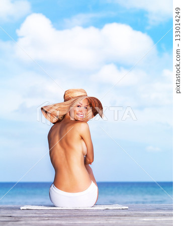 Travel, relax and topless with woman at beach for sunbathing, summer break and freedom in Bali. Sexy, blue sky and tropical with girl in bikini on vacation for mockup, peace and beauty on trip 133014249