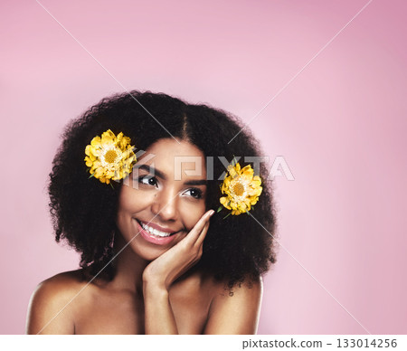 Happy woman, thinking and flowers in hair in studio, pink background and mockup for aesthetic cosmetics. Face, african model and thought with floral plants, afro and beauty ideas for natural skincare 133014256