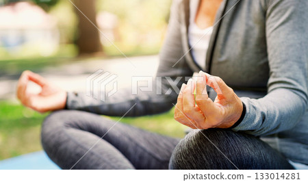 Woman in park, yoga and meditation with lotus pose, fitness outdoor with zen and spiritual healing. Female person hand, exercise in nature and meditate for health with wellness and mindfulness 133014281