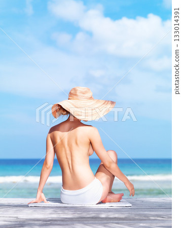 Travel, relax and topless with woman at beach for sunbathing, summer break and freedom in Bali. Sexy, blue sky and tropical with back of girl in bikini on vacation for mockup, peace or beauty on trip Travel, relax and topless with woman at beach for sunbathing, summer break and freedom in Bali. Sexy, blue sky and tropical with back of girl in bikini on vacation for mockup, peace or beauty on trip 133014391