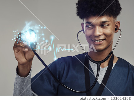 Happy man, doctor and stethoscope for futuristic healthcare, cardiology or heart rate. Male medical professional with smile checking cardiovascular, rhythm or sound against a grey studio background Happy man, doctor and stethoscope for futuristic healthcare, cardiology or heart rate. Male medical professional with smile checking cardiovascular, rhythm or sound against a grey studio background 133014398