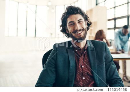 Portrait, startup and happy man in office, start up business project and entrepreneur at design agency. Young boss with smile on face, businessman or professional leader in chair at startup company. 133014468