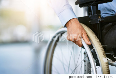 Wheelchair, disability and man hand holding wheel in a hospital for healthcare. Disabled, mobility problem and male person in a clinic for support and medical care with hands of patient and mockup 133014470