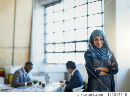 Muslim, business woman and portrait in office with a smile, hijab and arms crossed for career pride. Arab female entrepreneur or leader at a corporate workplace with a positive mindset and motivation Muslim, business woman and portrait in office with a smile, hijab and arms crossed for career pride. Arab female entrepreneur or leader at a corporate workplace with a positive mindset and motivation 133014546
