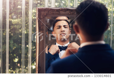 Mirror, wedding and man with a bow tie, marriage and prepare for ceremony, love and celebration. Male person, gentleman and groom with a suit, fashion and ready for event with romance and reflection Mirror, wedding and man with a bow tie, marriage and prepare for ceremony, love and celebration. Male person, gentleman and groom with a suit, fashion and ready for event with romance and reflection 133014601