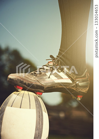 Rugby man, feet and sports ball outdoor on a pitch for action, goal or score. Male athlete closeup of shoes playing in sport competition, game or start training for fitness, workout or exercise 133014653