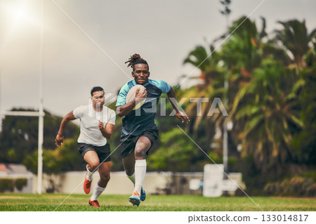 Rugby, chase and black man with ball running to score goal on field at game, match or practice workout. Sports, fitness and motion, player in action and blur on grass with energy and skill in sport. 133014817