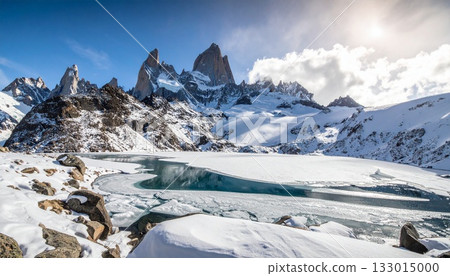 A magnificent view of snow-capped mountains and a frozen lake 133015000