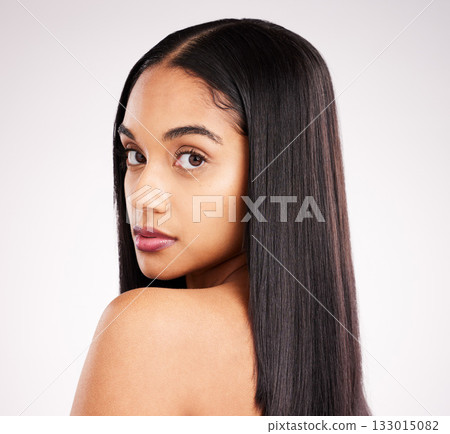 Hair, skin glow and beauty portrait of a woman in a isolated, white background and studio with salon treatment. Cosmetics, self care and young female model with healthy hairstyle texture and makeup 133015082