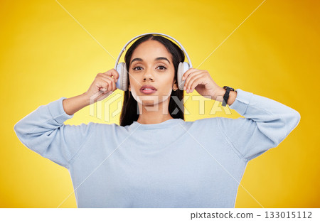 Music, headphones and portrait of woman in studio for streaming, online radio and audio. Relax, media and podcast with female isolated on yellow background for technology, listening and connection Music, headphones and portrait of woman in studio for streaming, online radio and audio. Relax, media and podcast with female isolated on yellow background for technology, listening and connection 133015112
