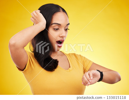 Late, watch and surprise of a woman in a studio looking at time with alarm feeling shocked. Isolated, yellow background and young female model with shock from watching the clock and smartwatch Late, watch and surprise of a woman in a studio looking at time with alarm feeling shocked. Isolated, yellow background and young female model with shock from watching the clock and smartwatch 133015118