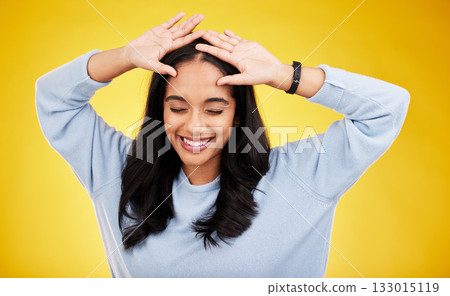 Happy, dance and face of woman on yellow background for positive mindset, happiness and freedom. Smile, mockup space and isolated girl with hands on head for dancing, relaxing and calm in studio Happy, dance and face of woman on yellow background for positive mindset, happiness and freedom. Smile, mockup space and isolated girl with hands on head for dancing, relaxing and calm in studio 133015119