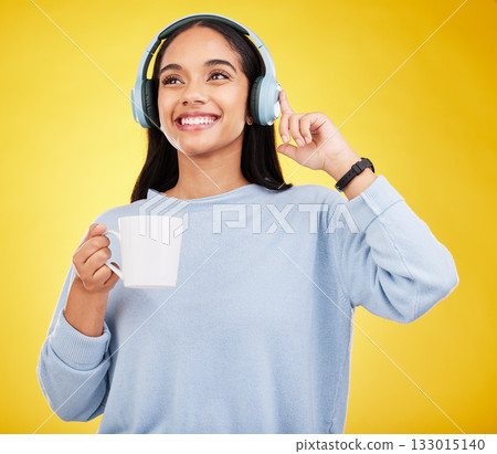 Coffee, music and headphones with woman in studio for streaming, online radio and relax. Smile, media and podcast with female isolated on yellow background for technology, listening and connection Coffee, music and headphones with woman in studio for streaming, online radio and relax. Smile, media and podcast with female isolated on yellow background for technology, listening and connection 133015140
