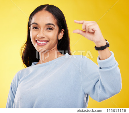 Showing, small and portrait of a woman with hands isolated on a yellow background in a studio. Happy, measurement and a girl with a review, gesturing size and opinion with fingers on a backdrop Showing, small and portrait of a woman with hands isolated on a yellow background in a studio. Happy, measurement and a girl with a review, gesturing size and opinion with fingers on a backdrop 133015156