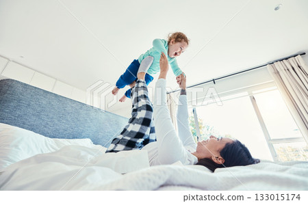 Bed, morning and a mother playing with her daughter in a bedroom of their home together for bonding. Family, kids or love with a woman and girl child having fun together after waking up on a weekend Bed, morning and a mother playing with her daughter in a bedroom of their home together for bonding. Family, kids or love with a woman and girl child having fun together after waking up on a weekend 133015174