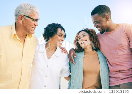 Happy family, couple and parents on vacation or holiday bonding together smile and having fun outdoors. People, man and woman embrace with mother and father as love, care and support during weekend Happy family, couple and parents on vacation or holiday bonding together smile and having fun outdoors. People, man and woman embrace with mother and father as love, care and support during weekend 133015195