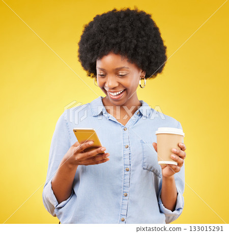 Happy, phone and black woman with coffee in studio, texting and laughing against yellow background. Smartphone, message and female with tea while browsing social media, app or online dating website Happy, phone and black woman with coffee in studio, texting and laughing against yellow background. Smartphone, message and female with tea while browsing social media, app or online dating website 133015291