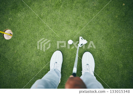 Grass, golf hole and man with club on course for game, practice and training for golfing competition. Professional golfer, sports and top view of male shoes hit ball for winning, score or tee stroke 133015348