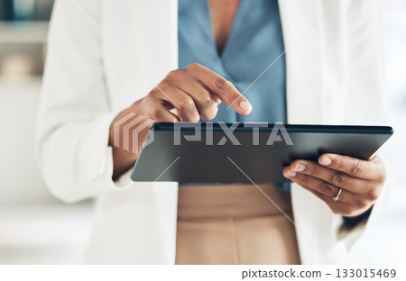 Tablet, typing and hands of woman in office for networking, information and project analysis. Executive, technology and digital with zoom of female browsing online for app, email and connection Tablet, typing and hands of woman in office for networking, information and project analysis. Executive, technology and digital with zoom of female browsing online for app, email and connection 133015469