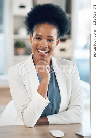 Happy, success and portrait of a black woman in the office with a computer working or doing research. Business, smile and African female corporate manager sitting at her desk with a pc in workplace. 133015472
