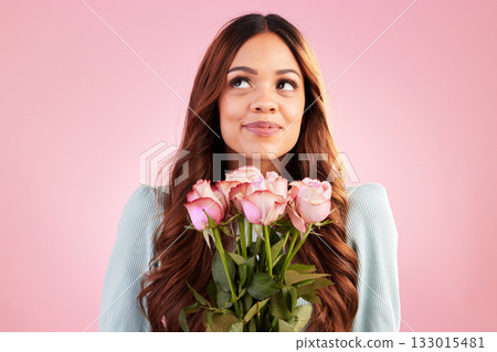 Happy, thinking and female with roses in a studio for valentines day, romance or anniversary. Happiness, smile and young woman model from Mexico with a bouquet of flowers isolated by pink background. 133015481