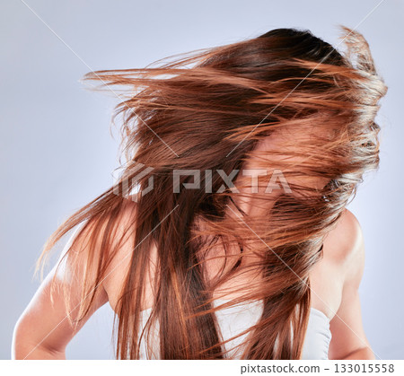 Hair movement, model and balayage of woman with beauty and hairstyle texture in a studio. Cosmetics, shampoo treatment and keratin of a female with healthy, clean and haircare shine from salon 133015558
