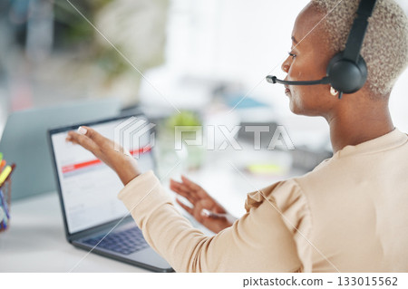 Black woman, call center and consulting with headphones on laptop for customer service or support at office desk. African American female consultant agent talking on computer with headset for advice 133015562
