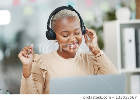Dance, happy and black woman with music during work, radio break and listening to audio. Smile, stress relief and dancing African employee with headphones for streaming a podcast, songs and playlist Dance, happy and black woman with music during work, radio break and listening to audio. Smile, stress relief and dancing African employee with headphones for streaming a podcast, songs and playlist 133015567