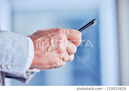 Hands, phone and email with a business man in his office, closeup for communication or networking. Mobile, contact and internet with a male employee typing a text message or making a call 133015629