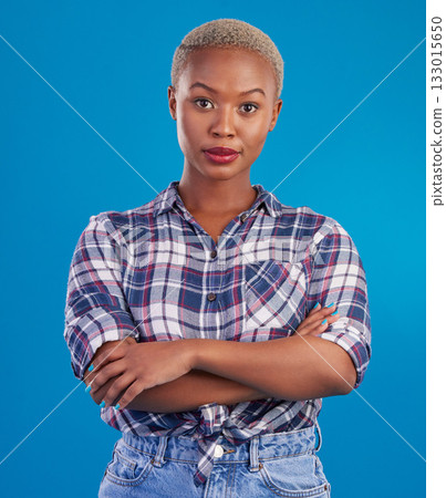 Serious, confidence and portrait of black woman with crossed arms, proud and empowerment in studio. Fashion, beauty and attractive girl on blue background with pride, success mindset and motivation Serious, confidence and portrait of black woman with crossed arms, proud and empowerment in studio. Fashion, beauty and attractive girl on blue background with pride, success mindset and motivation 133015650