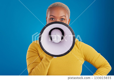 Megaphone, change and speaker with black woman in studio for awareness, democracy and opinion. Vote, announcement and message with female on blue background for empowerment, strike and choice Megaphone, change and speaker with black woman in studio for awareness, democracy and opinion. Vote, announcement and message with female on blue background for empowerment, strike and choice 133015655