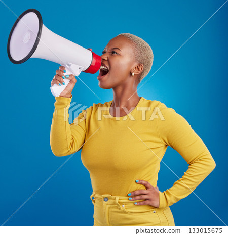 Megaphone, angry and screaming black woman in studio for message, broadcast or vote on blue background. Speaker, microphone and girl protest for change, democracy and justice, noise and womens rights 133015675