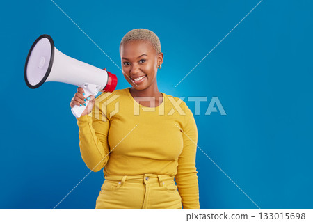 Black woman, megaphone and portrait, protest and voice, freedom of speech and activism on blue background. Female smile, broadcast and speak out, rally and mockup, loudspeaker with opinion in studio 133015698