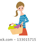 Upper body of a woman holding a laundry basket 133015715