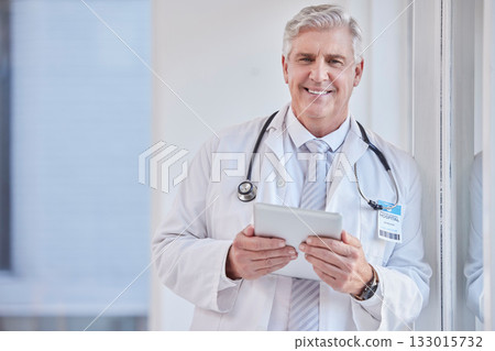 Portrait, man and doctor with tablet, healthcare and career with success, connection and research in hospital. Face, mature male and medical professional with technology, online reading and diagnosis 133015732