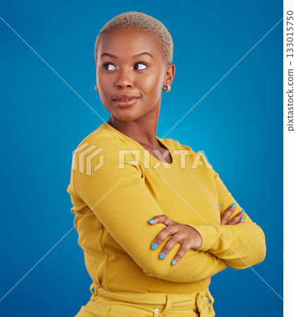 Proud profile of a black woman isolated on a blue background with confidence and creative mindset. Young african female or model with empowerment, fashion and beauty ideas in studio 133015750