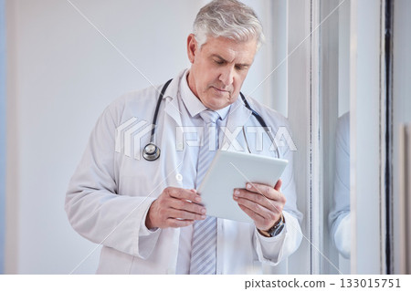 Doctor, tablet and senior man in hospital for research, telehealth or online consultation. Healthcare, technology and elderly medical professional with touch screen for wellness app in health clinic. 133015751