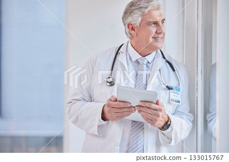 Thinking, man and doctor with tablet, healthcare or idea for solution, diagnosis or planning. Mature male, medical professional or worker with device, wonder or online research for wellness or window 133015767