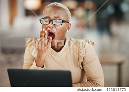 Office, laptop and yawning black woman with glasses, reading email or online research report at night. Computer, overtime and tired African journalist working late on article for digital news website 133015773