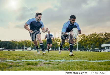 Rugby, sports and men training, score and exercise for balance, endurance and workout for wellness. Team, male athletes or players with ball, victory or winning on grass field, competition and active Rugby, sports and men training, score and exercise for balance, endurance and workout for wellness. Team, male athletes or players with ball, victory or winning on grass field, competition and active 133015810