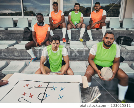 Rugby team, people and coach with strategy on clipboard for exercise event, game formation or match planning at stadium. Diversity group, sports men portrait and training goals, discussion or mission 133015811
